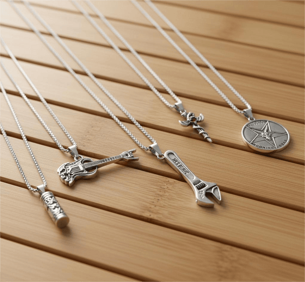PARADOX COLLECTIVE High Stakes 5-Piece Collector's Pendant Set – WRENCH, SKULL ROCKING GUITAR, ZEN-CYLINDER, SWORD OF ANGLE, & GOAT STAR Necklaces on 24 Inch Stainless Steel Chain for Mens and Boys